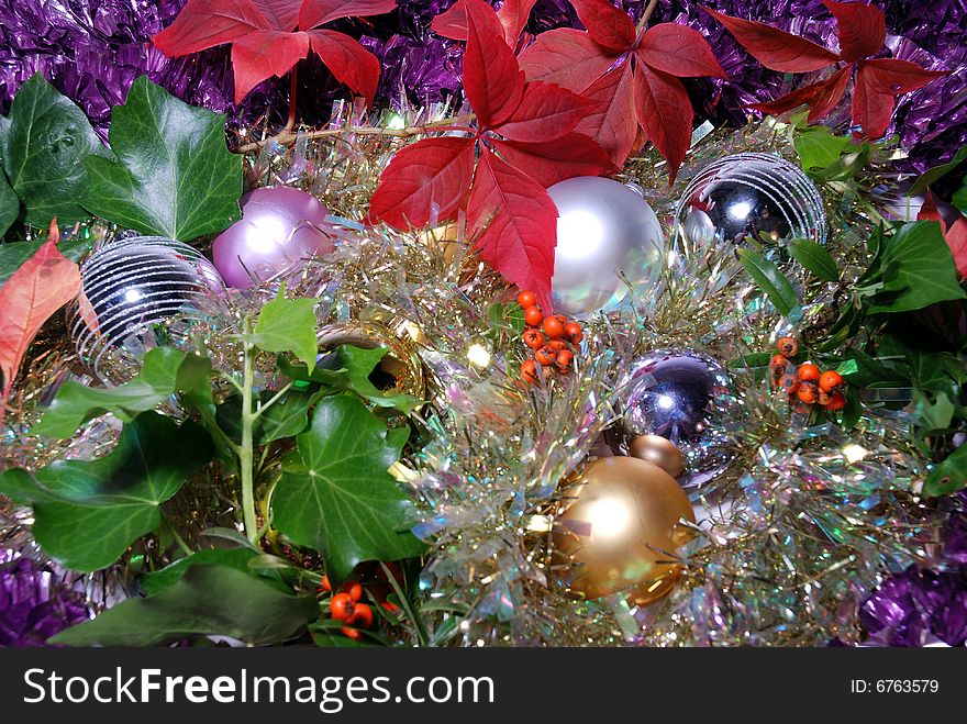 Christmas background with tinsel and baubles