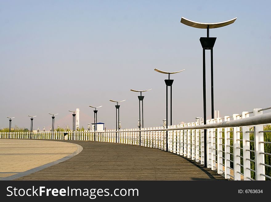 The street lamp with the blue sky background.