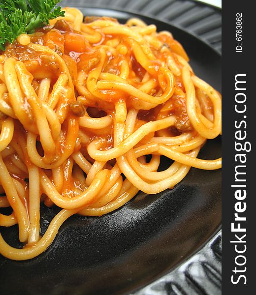 A close-up picture of a plate with spaghetti. A close-up picture of a plate with spaghetti