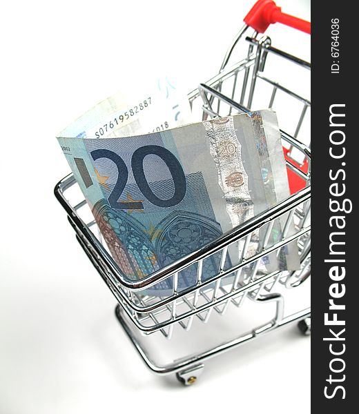 A twenty Euro note in a shopping cart. A twenty Euro note in a shopping cart