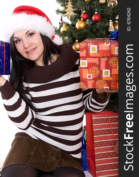 Happy brunette woman over christmas tree. Happy brunette woman over christmas tree