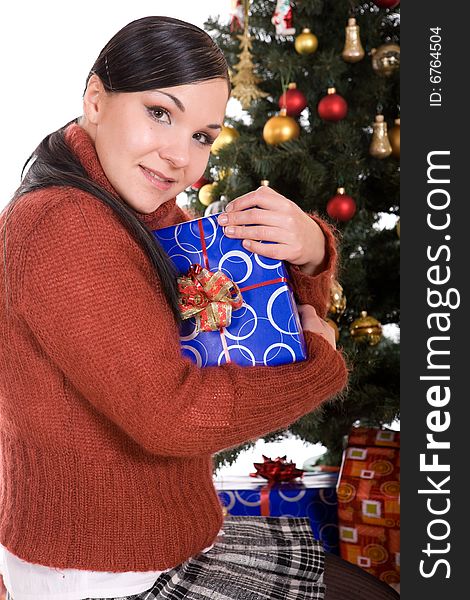 Happy brunette woman over christmas tree. Happy brunette woman over christmas tree