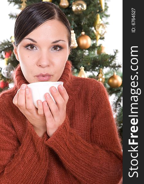 Happy brunette woman over christmas tree. Happy brunette woman over christmas tree