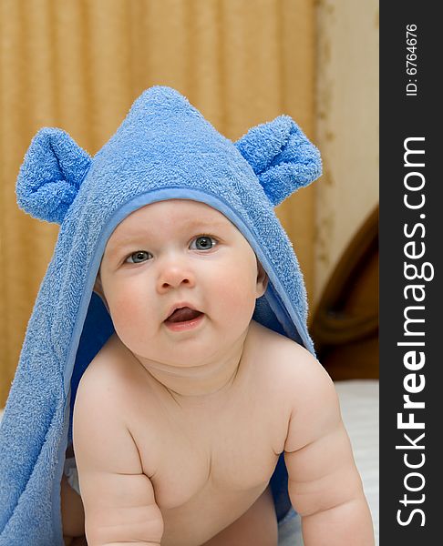 Smiling Baby In Blue Towel On Bed 12