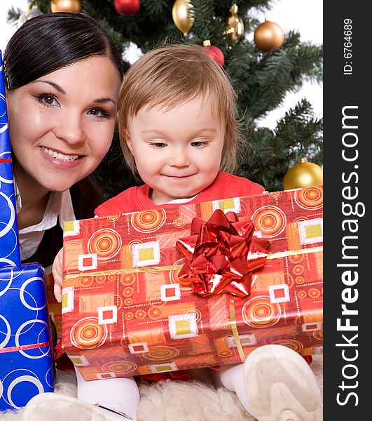 Happy mother and daughter over christmas tree. Happy mother and daughter over christmas tree