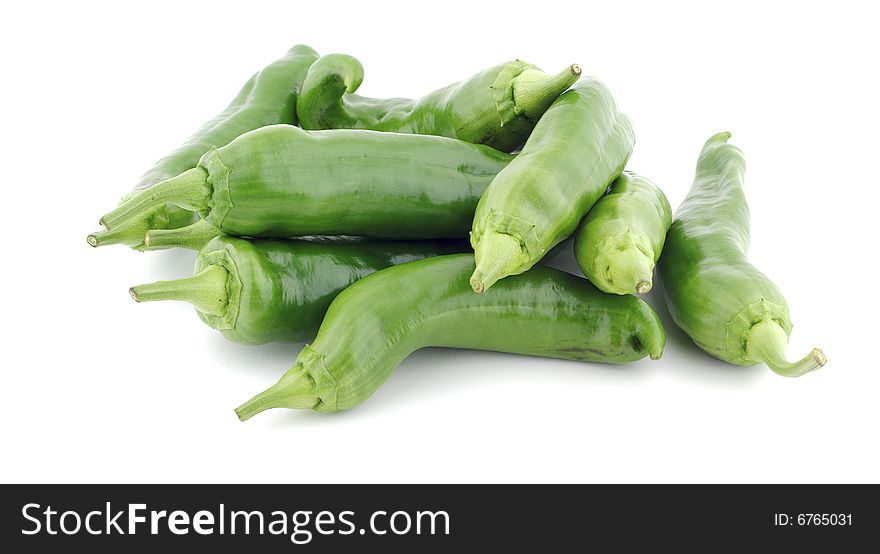Pile of green peppers on a white background. Pile of green peppers on a white background