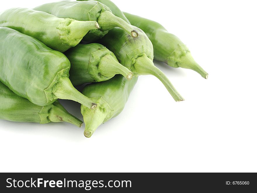 Pile of green peppers placed in a corner. Pile of green peppers placed in a corner