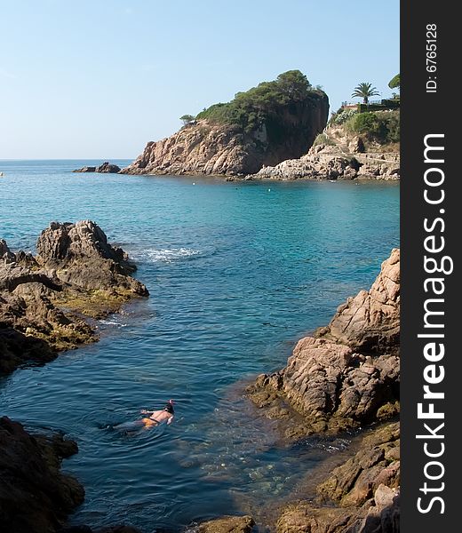 A young boy Swimming under water in the costa brava, Spain.