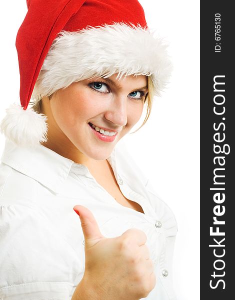 Girl in Santa hat showing thumbs up. Girl in Santa hat showing thumbs up.