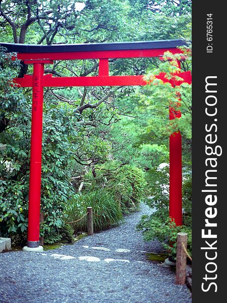 Torii gate in Japanese garden at Ryoanji Temple in Kyoto