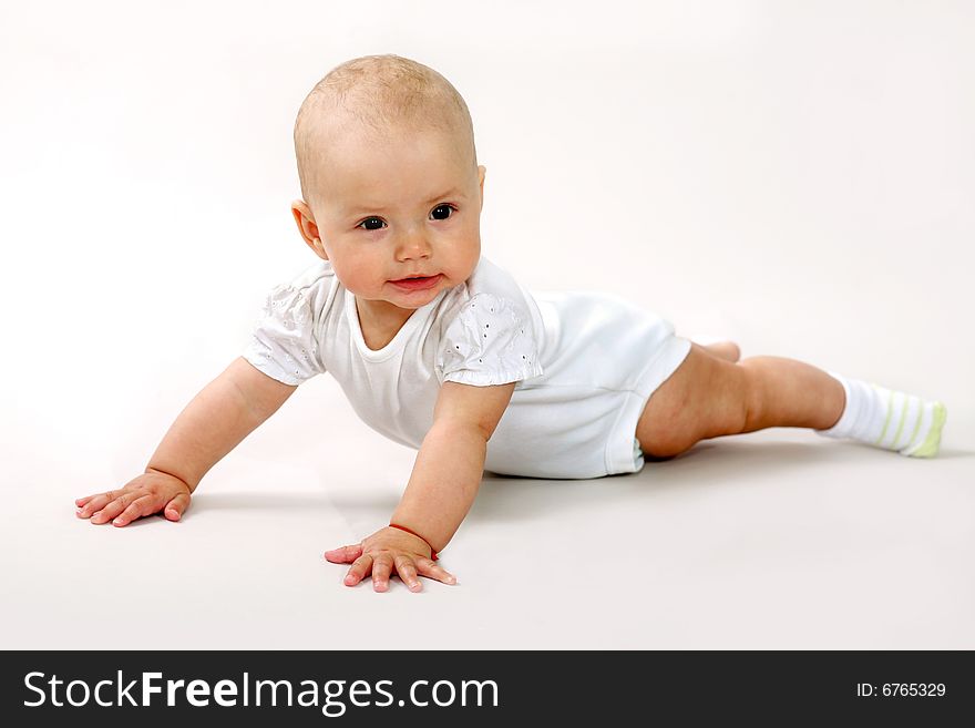 An image of a little baby crawning in studio