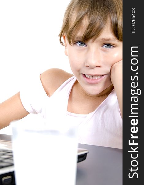 Healthy girl with milk and laptop on an isolated background