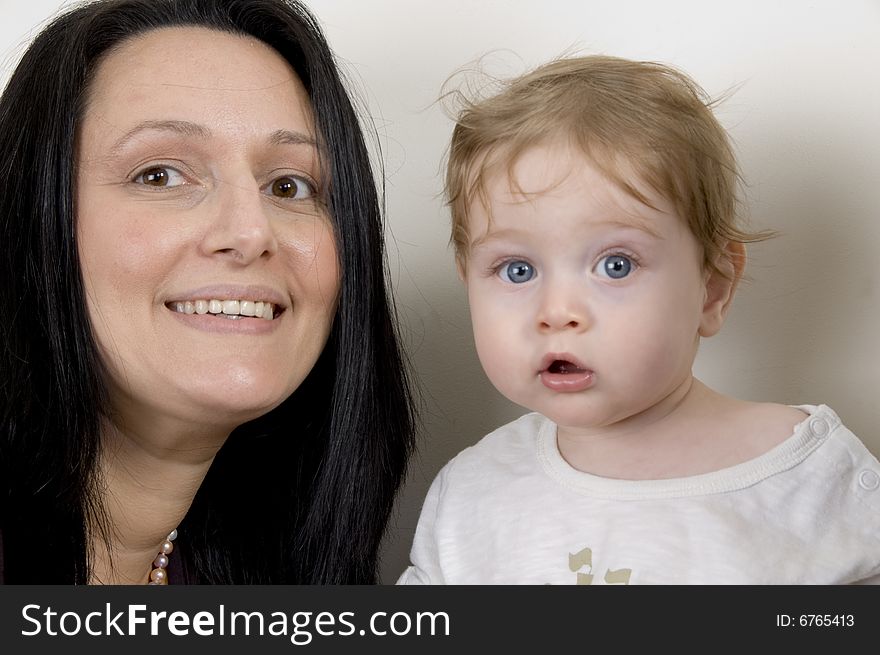 Mother and child looking to camera