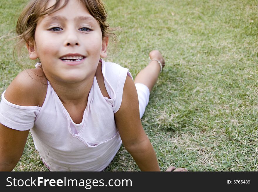 Pretty young girl playing in the garden