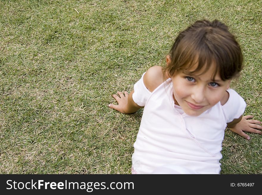 Pretty young girl playing in the garden