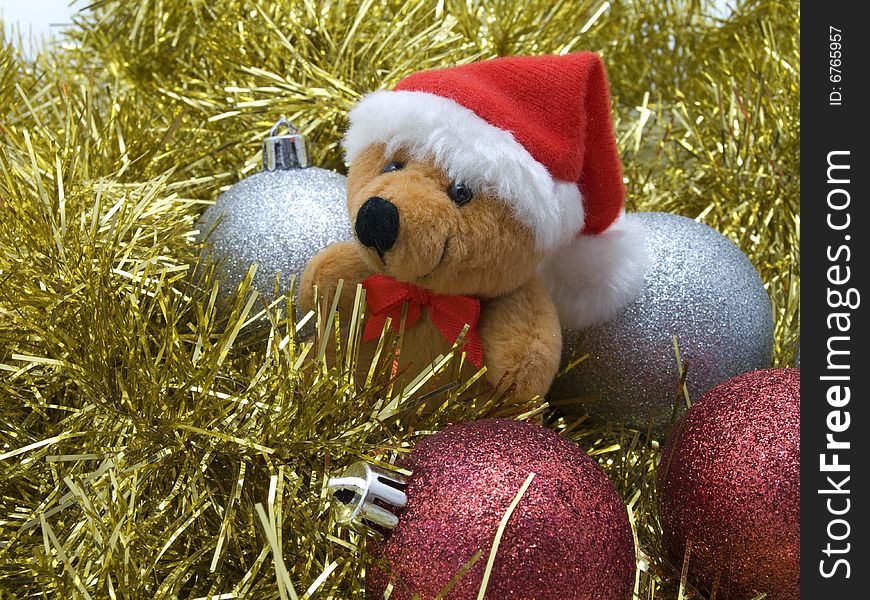 Teddy Bear and decorative Christmas bauble.