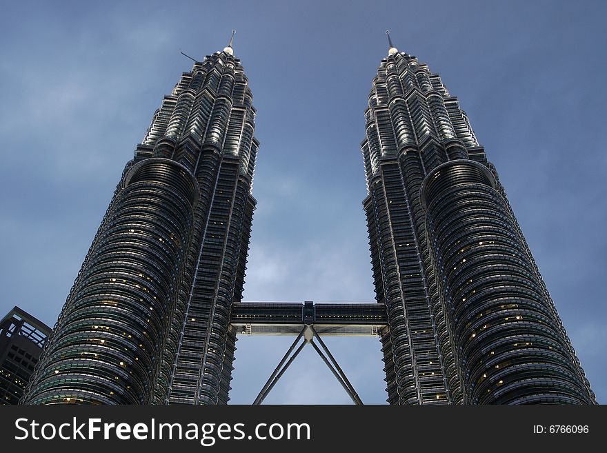 Petronas twin towers, still two of the highest buildings. At the time of sunfall, the decorative lights are turned on. Petronas twin towers, still two of the highest buildings. At the time of sunfall, the decorative lights are turned on.