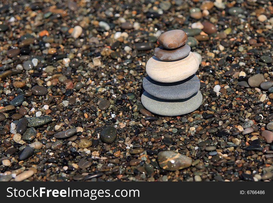 Five pebbles tower in the Sea beach