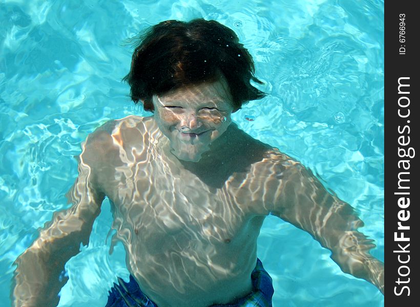 Image of boy smiling underwater. Image of boy smiling underwater