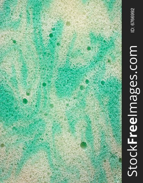 Macro shot of green sponge, abstract background