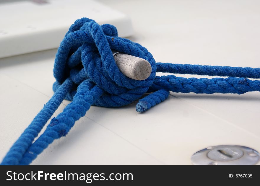 Blue rope with knot tied on a boat