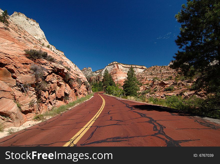 Scenic red highway leading through Zion National Park area