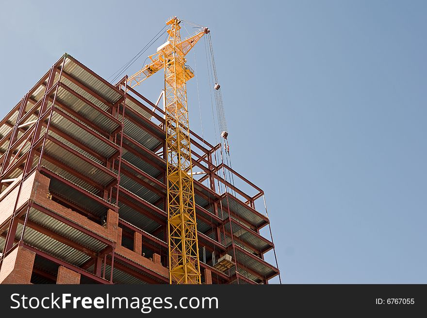 Construction, new office building and crane.