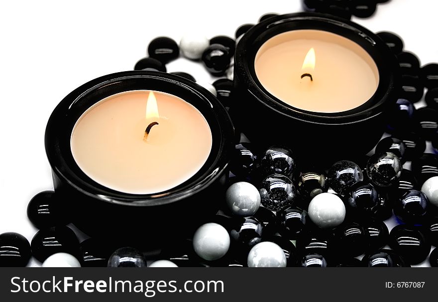 Candles in candlesticks on a white background