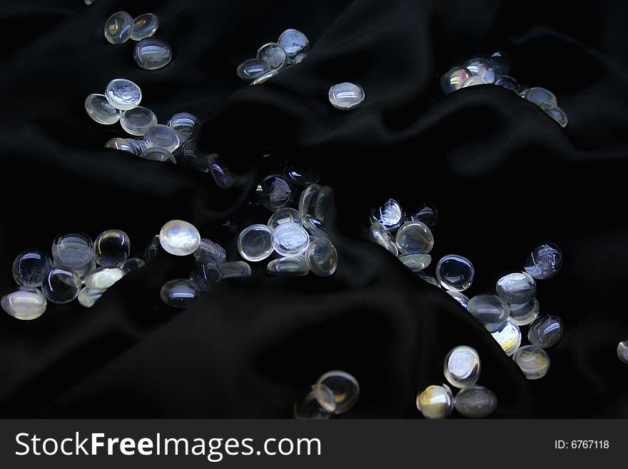 Glass balls on black silk