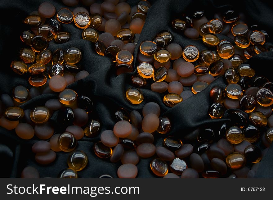 Glass balls on black silk