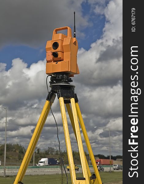 Surveying highway - insturment set on the side of the road.