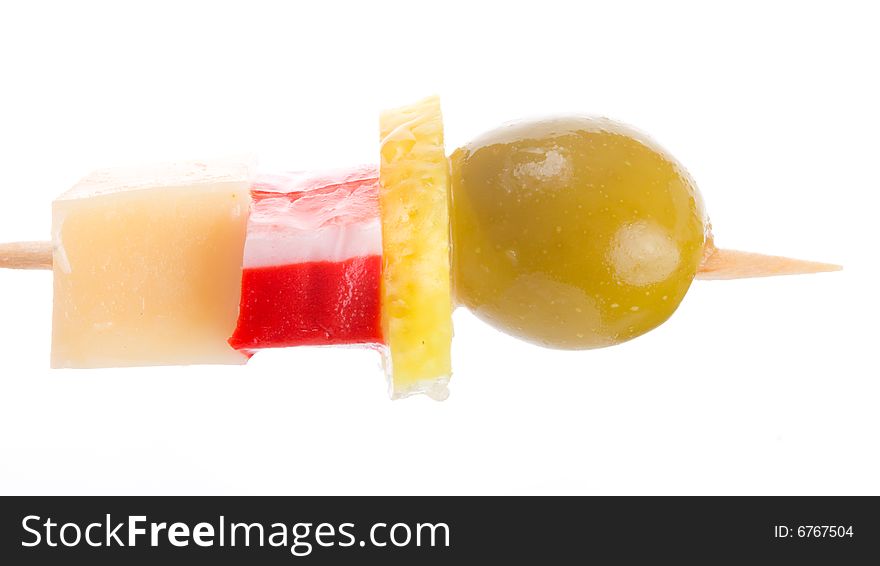 Close-up canape with olive, lemon, crab meat and cheese, isolated on white