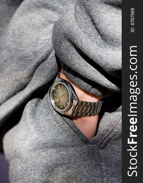 Relaxation concept. Hand with wrist-watch into a pocket. Relaxation concept. Hand with wrist-watch into a pocket
