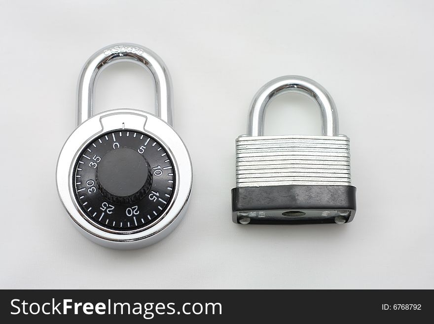 Picture of 2 types of locks, a combination lock and a padlock.   The theme of the shot is securing your future.