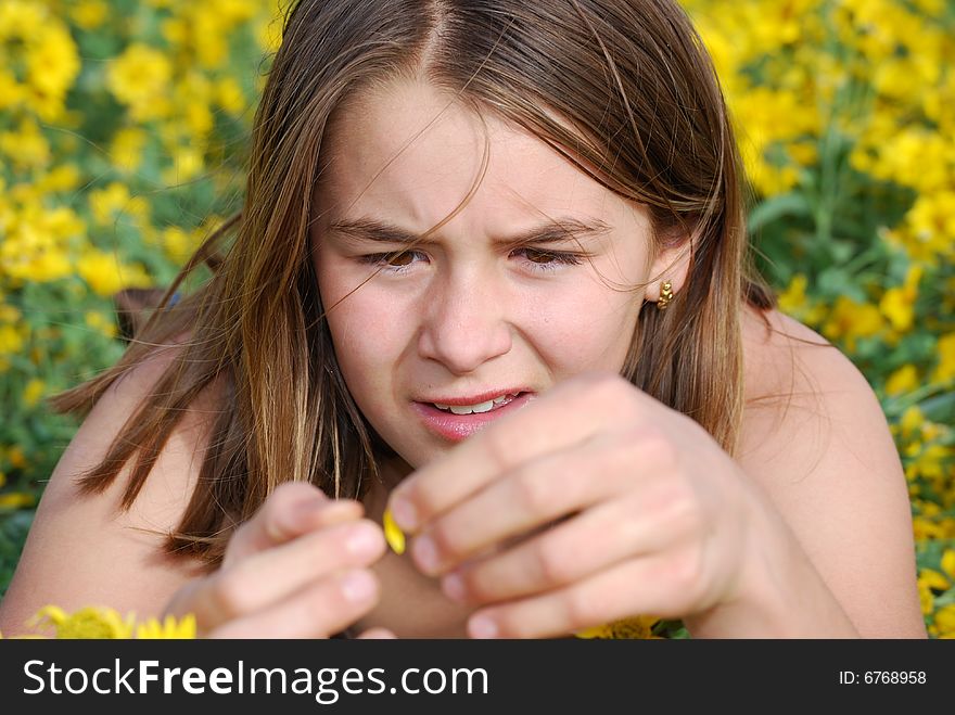 Girl Looking At Flower In Summer