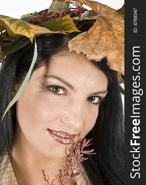 Close-up of beautiful face of autumn women,autumn make-up and laurel wreath. Close-up of beautiful face of autumn women,autumn make-up and laurel wreath
