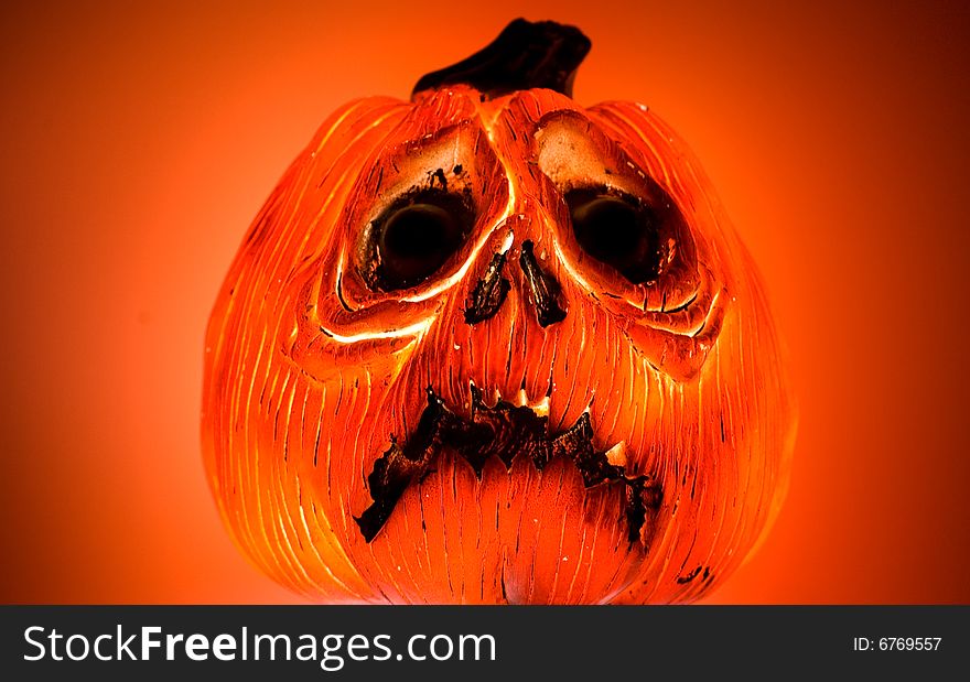 A glowing but frowning Jack O Lantern. A glowing but frowning Jack O Lantern