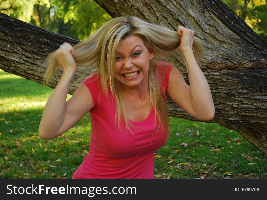 A frustrated woman pulling hair