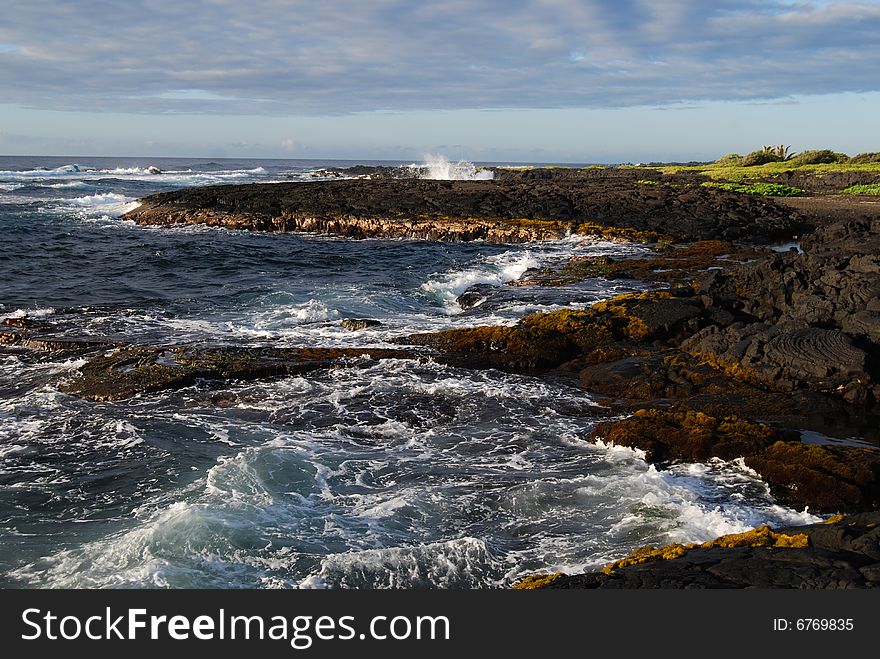 Black shoreline of Punaluu' Beach on the Big Island of Hawaii. Black shoreline of Punaluu' Beach on the Big Island of Hawaii.