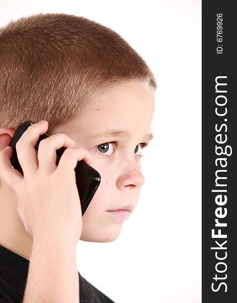 Young boy is holding the phone and wait for call. Young boy is holding the phone and wait for call