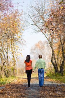 Young Couple Walking In The Park Royalty Free Stock Photo Young Couple Walking In The Park Royalty Free Stock Photo