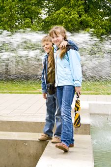 Boy, Girl And Fountain Royalty Free Stock Photography