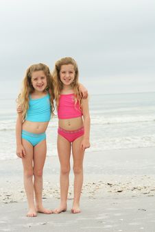 Twin Sisters At The Beach Vertical Royalty Free Stock Photo
