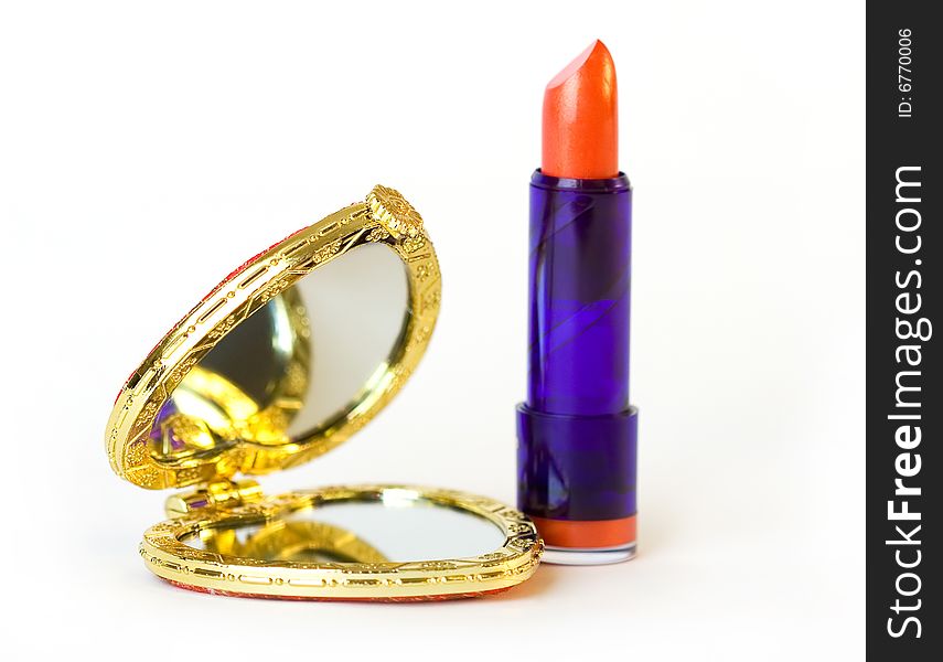 Heart-shaped mirror and lipstick