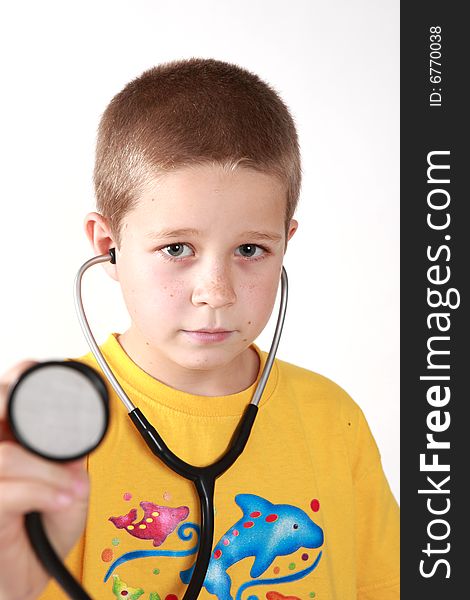 Young boy's direct look into camera with auscultoscope wearing. Young boy's direct look into camera with auscultoscope wearing