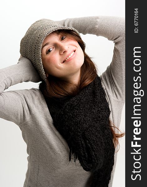 Playful woman, or teen in fall or winter clothing wearing a scarf. Playful woman, or teen in fall or winter clothing wearing a scarf.