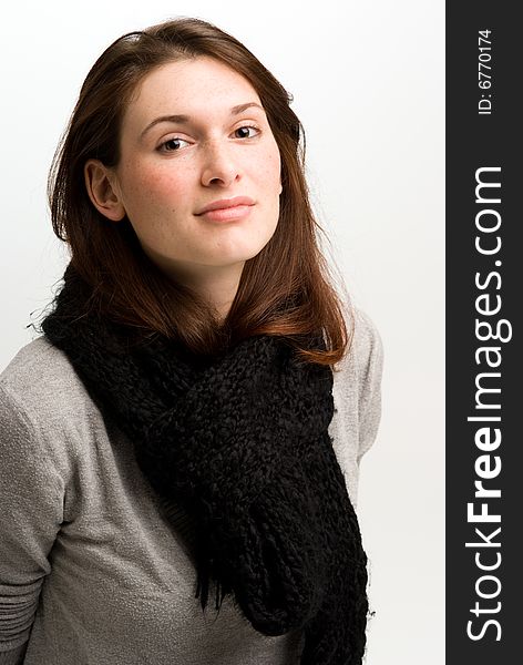 Woman, or teen in fall or winter clothing wearing a scarf. Woman, or teen in fall or winter clothing wearing a scarf.