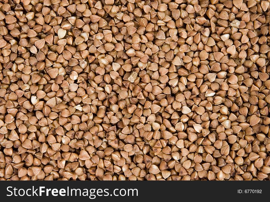 Background of brown buckwheat. Close up