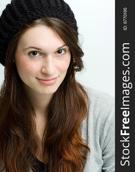 Woman, or teen in fall or winter clothing wearing a hat. Woman, or teen in fall or winter clothing wearing a hat.