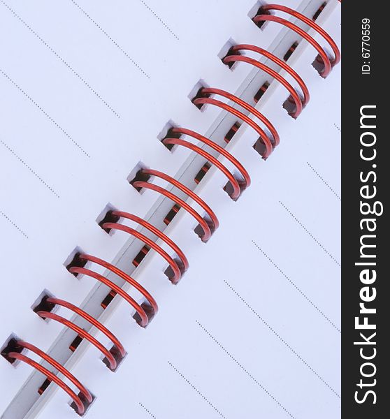 Notebook with red metal spiral. Notebook with red metal spiral